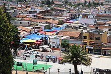 Tianguis tarps covering a street in Metepec, Mexico State TianguisMetepec.JPG