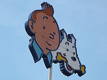 Tintin and Snowy (Herge), on the roof of the former headquarters of Le Lombard near Brussels-South railway station Tintin and Snowy on the roof.jpg