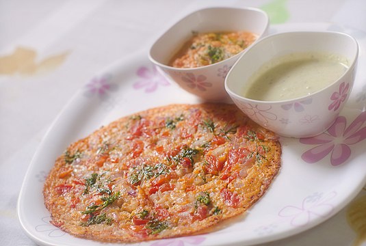 Uttapam is one of the many varieties of dosa prepared in India and served for breakfast.