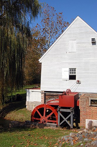 The steel millwheel in November 2008 WyeMillLRWalls.jpg