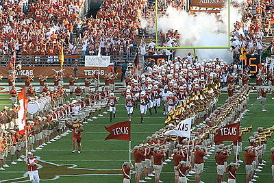 The opening of College football season is a major part of American pastime. Massive marching bands, cheerleaders, and colorguard are common at American football games.