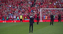 Arsene Wenger on the field of play at the conclusion of his final home game as manager of Arsenal F.C. 39 Merci Arsene - Goodbye Arsene! (41056012185).jpg