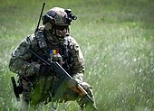 A Romanian special unit troop keeps its position during training as "Steadfast Defender" 2021. A Romanian special forces troop holds his position while training during Exercise Steadfast Defender 2021 210524-N-GP524-0011.jpg