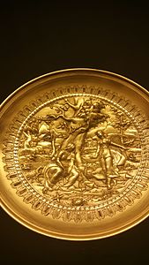 Day 10:Golden plates depicting women warriors.