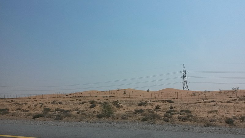 File:A point where the sky and sand dunes join together.jpg