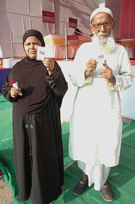 An elderly couple voters showing mark of indelible ink after casting their votes, at a polling booth, during the Bihar Assembly Election, in Gaya on October 16, 2015 (1).jpg
