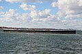 An unusually long barge on Lake Ontario (27899868295).jpg