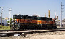 A four-axle EMD GP38-2 B-unit coupled with six-axle SD40-2 A-unit BNSF - Going Cabless.jpg