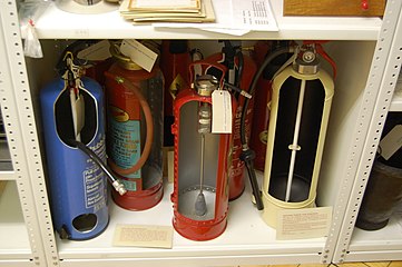 Fire extinguishers in a museum storeroom, cut to display their inner workings