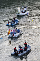 Boats of various sizes carrying and accompanying the statue of Virgin Mary Madonna Fiumarola, Rome, Italy