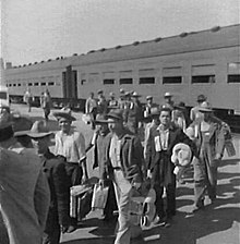 Mexican guest workers arrive in Los Angeles as part of Mexican participation in World War II via the Bracero Program, freeing U.S. labor to fight overseas. Los Angeles, CA, 1942 BraceroProgram.jpg