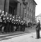 An English choir wearing their school caps in 1963