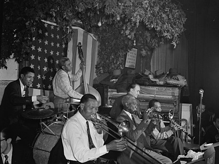 Bunk Johnson, George Lewis, Alcide Pavageau, Kaiser Marshall, Jim Robinson, and Don Ewell, Stuyvesant Casino, New York, N.Y., ca. June 1946 (William P. Gottlieb 04561).jpg