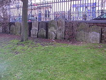 Gravestones in the former burial ground now line the walls of the former Hanover Chapel burial ground. Burial Ground at former Hanover Chapel, Queen's Road, Brighton.JPG