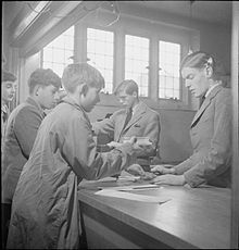 Boys buy sweets from the tuck shop at Ampleforth in 1943 Catholic Public School- Everyday Life at Ampleforth College, York, England, UK, 1943 D17367.jpg