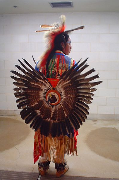Dancer in traditional regalia attends a pow-wow at Chemawa Indian School