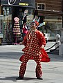 * Nomination A Chinese juggler at the Graben, Vienna. He threw the glass bottle and catched it again with the wooden spoon in his mouth. --Herzi Pinki 23:04, 3 October 2013 (UTC) * Promotion Good quality. FP --Moroder 05:04, 4 October 2013 (UTC)