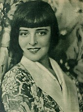 Promotional portrait of Moore at the height of her fame, c. 1927, showing the famous Dutchboy bobbed haircut that she made famous, and which she apparently kept until the day she died Colleen Moore photographed by Henry Freulich.jpg