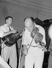 Cajun fiddler at 1938 National Rice Festival, photographed by Russell Lee. CrowleyCajunFiddler1938.jpg