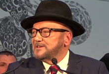 Galloway making his post-declaration speech at the 2024 Rochdale by-election count George Galloway, Rochdale by-election 2.png