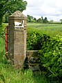 The gatepost and pedestrian steps combination at The Hill farm, Dunlop, East Ayrshire.