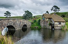 The Hobbit proverb "You've got to have grist before you can grind" - you cannot make flour without grain - would have been obvious to all who knew the Hobbiton mill. Hobbiton mill and double-arched bridge (cropped).jpg