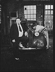 Irwin R. Steffy having his car gone over in the Pierson Motor Company garage