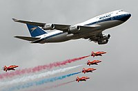 British Airways 747-400 (in BOAC colors) with Red Arrows