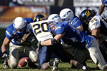 Forsett (no. 20) at the 2007 Armed Forces Bowl Justin Forsett fumbles AFB 071231-F-0558K-010.JPEG