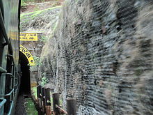 A train entering a tunnel