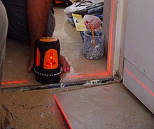 Levelling of ceramic tiles floor with a laser device LaserFlooring1.jpg