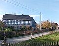 Northern residential stable, eastern residential building, southern side building and western barn of a four-sided courtyard