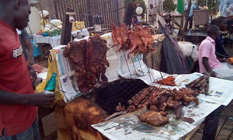 File:Man at Work in Africa - Man Selling Roasted Meat Popular Called Suya in Africa.jpg