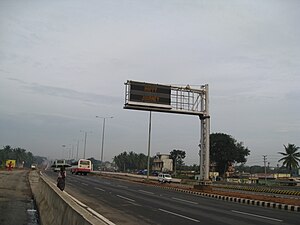 A dual row matrix LED sign on National Highway 4, in Bangalore, India