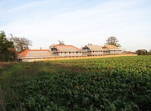 New houses under construction in Norfolk. Planning permission was required for such a development and would be granted by the local planning authority, subject to conditions. New houses under construction in The Street - geograph.org.uk - 1588206.jpg