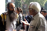 Prof. Jitendra Shah interacting with a participant during tea break