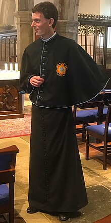 A chapter priest of the shrine, wearing the distinctive mozzetta of that rank. Our Lady of Willesden - chapter priest.jpg