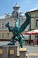 * Nomination Griffin statue on Market Square in Mielec, sculpture by Agnieszka Świerzowicz-Maślaniec and Marek Maślaniec 2 --Kroton 20:20, 10 July 2016 (UTC) * Decline  Oppose driving cars in the background (apparently avertable) directly behind the statue are a no-go for me, slightly perspective distortion and noisy, I'd prefer a better DOF here. Too many points IMHO why it's not a QI. --Carschten 09:20, 18 July 2016 (UTC)