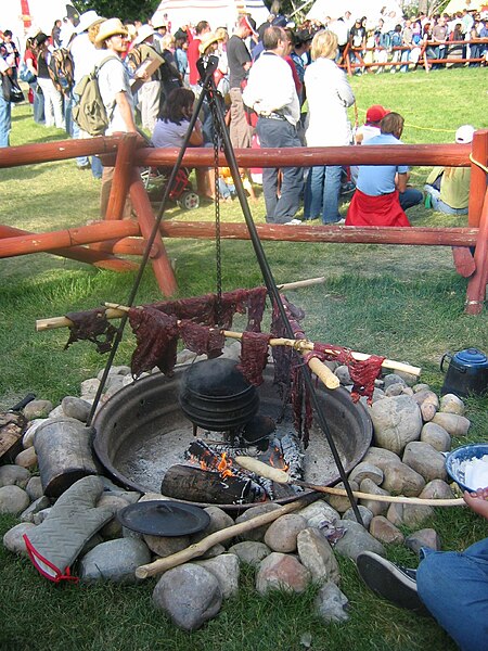 Demonstration at the Calgary Stampede of a traditional method of drying meat for pemmican