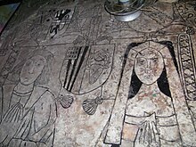 Richard Littleton and Alice Wynnesbury, on incised slab of their recessed table tomb in the south nave aisle, St. Michael's church. Penkridge St Michael - Richard Littleton (d. 1518) Alice Wynnesbury (d. 1529) tomb.jpg