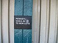 Another small sign along the pillars, but with braille symbols.