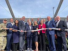 Baker and other local officials and business leaders celebrate the October 2022 completion of a modernization project for the Port of Boston Port of Boston modernization ribbon cutting ceremony (FeWGcbbWYAUeP6).jpg