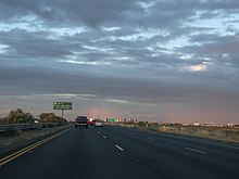 Sacramento as seen from the distance in the eastbound lanes of I-80 in Yolo County Rainbow Over Sacramento California - panoramio.jpg