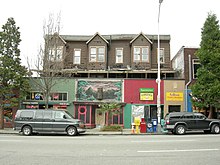 The Wayne Apartments in Belltown (built c. 1890; the storefronts date from 1911), among Seattle's oldest surviving multi-unit dwellings. Always working-class housing, was given Landmark status in 2015 despite its quite deteriorated condition. Nonetheless, no controls were ever put in place and after a fire in June 2022 it was demolished in August 2022. Seattle - 2224-28 2nd Ave.jpg