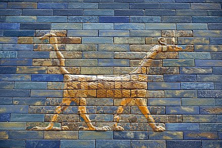 The mušḫuššu is a serpentine, draconic monster from ancient Mesopotamian mythology with the body and neck of a snake, the forelegs of a lion, and the hind-legs of a bird.[32] Here it is shown as it appears in the Ishtar Gate from the city of Babylon.[32]