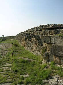 Foundation of Etruscan temple at Tarquinia, scene of the Tages legend. Tarquinia - Ara della Regina.jpg