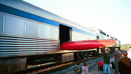 Loading a canoe into the baggage car requires a special technique, but can be done.