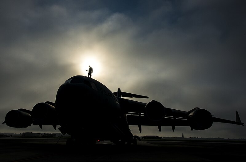 File:U.S. Air Force Tech. Sgt. Andrew Gravett, a crew chief with the 437th Aircraft Maintenance Squadron, walks along the top of a C-17 Globemaster III aircraft as he does a routine maintenance check of the aircraft 130604-F-LR006-011.jpg