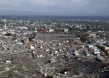 Damage following the 2004 tsunami in Banda Aceh. US Navy 050101-N-1229B-269 An aerial view of Banda Ache from an SH-60F Seahawk assigned to Helicopter Anti-Submarine Squadron Two (HS-2) Golden Falcons.jpg