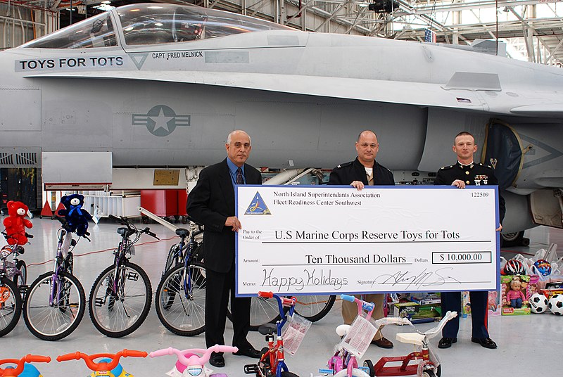 File:US Navy 091218-N-1878M-001 U.S. Marine Corps Reserves annual Toys for Tots campaign hold a ceremonial check representing a $10,000 donation by the employees of FRCSW during festivities.jpg